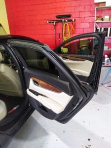 Close-up view of window tint work
